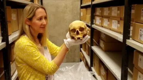 Leeds Museums and Galleries Kat Baxter, with a skull