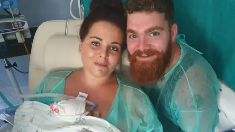 Matthew Beach Shannon Holbrook and Matthew Beach with their baby Scarlett-Rose