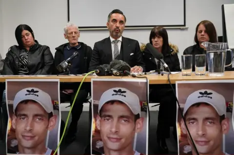 PA Media Sneddon family and lawyer Aamer Anwar (centre)