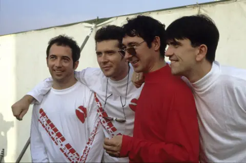 Getty Images The re-formed Buzzcocks line-up at the Reading Festival in 1990. From left: Pete Shelley, Steve Diggle, Steve Garvey and Mike Joyce