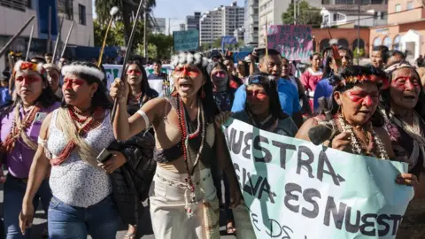 Jeronimo Zuñiga/Amazon Frontlines Nemonte Nenquimo leads a protest against the auctioning off of oil concessions
