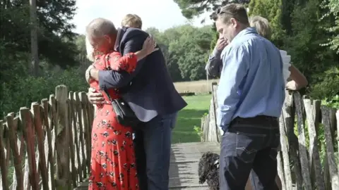 Keiron Tovell Tim Head embracing the mother of Kitt Blake