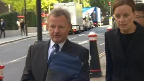 BBC Andy Hill arriving at court