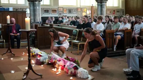 PA Media A church filled with young people during a vigil held in Nottingham