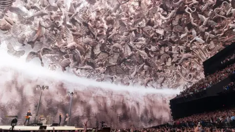 Treatment Studio U2 on stage at The Sphere