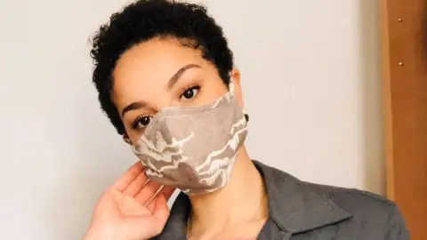 contributor photo Charlotte in a face mask