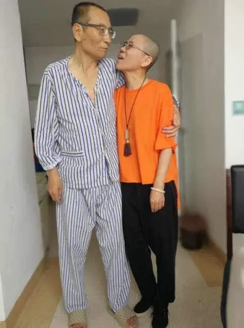 Supplied Liu Xiaobo and Liu Xia, he in pyjamas and she in outdoor clothes