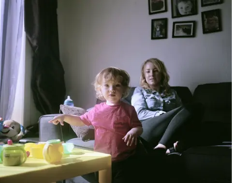 Sian Davey A small girl looks into the camera.