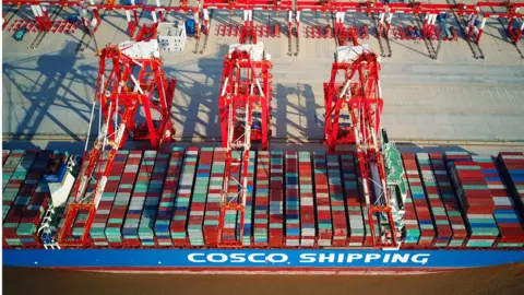 AFP/Getty This photo taken on December 6, 2017 shows a loaded cargo ship at the Yangshan Deep-Water Port, an automated cargo wharf, in Shanghai.