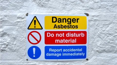 Getty Images Asbestos warning sign