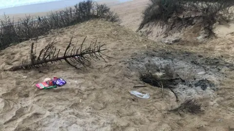 Friends of Fistral Dunes Burnt out fire and rubbish