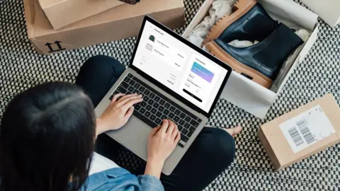 Getty Images Woman shopping online