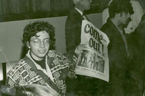 Photo by Diana Davies, The New York Public Library Martha Shelley holding Come Out!