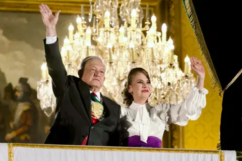 Alamy Mexico's President, Andres Manuel Lopez Obrador accompanied by his wife Beatriz Gutierrez Muller ahead the 213 Anniversary of the Grito of Mexico's Independence Day at Constitution Plaza on 15 September 2023 in Mexico City, Mexico