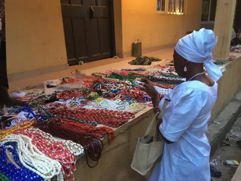Adedayo Okedare/BBC Traders ready with their colourful traditional beads to be sold to tourists