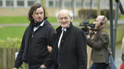 EPA Julian Assange's brother and father - arriving at court