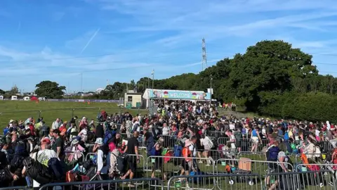 Isle of Wight Festival  Crowds queue up outside the Isle of Wight Festival site