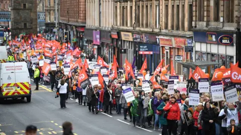 Getty Images Strikers march to George Square