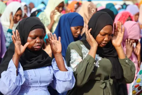 Samir Bol / Reuters Muslim women faithful attend Eid al-Fitr prayers