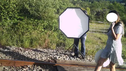 Network Rail Woman on the track filming