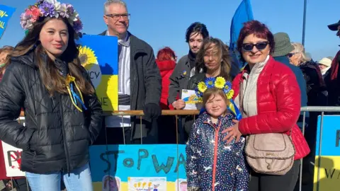 BBC Amelia and Avalyn took part in the rally with their Ukrainian grandmother