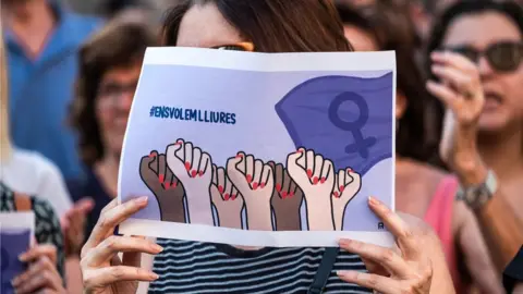 Getty Images After the "wolf pack" trial, demonstrations spread across Spain - this sign from June 2018 reads: "we want to be free"