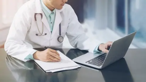Getty Images Doctor on laptop
