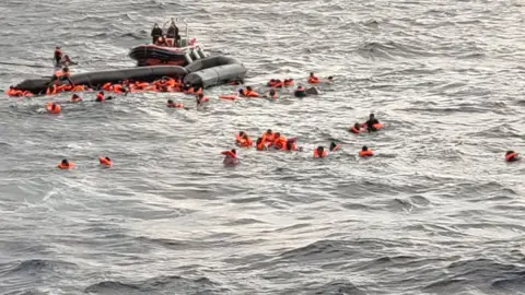 Open Arms / Reuters Image shows the capsized dinghy