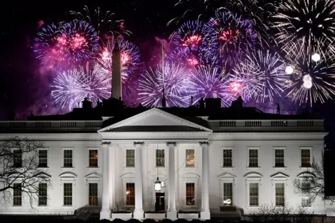 AFP Fireworks are seen above the White House at the end of the Inauguration day for US President Joe Biden in Washington, DC, on 20 January 2021.