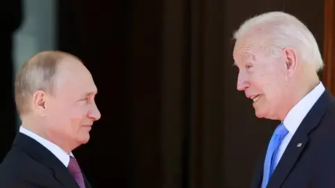 EPA Mr Biden and Mr Putin pictured at a face to face meeting
