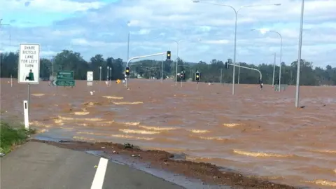 Queensland Department of Transport and Main Roads A flooded highway in Queensland