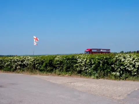 Peter Dench The flag of Saint George flies next to the A1. Nottinghamshire.