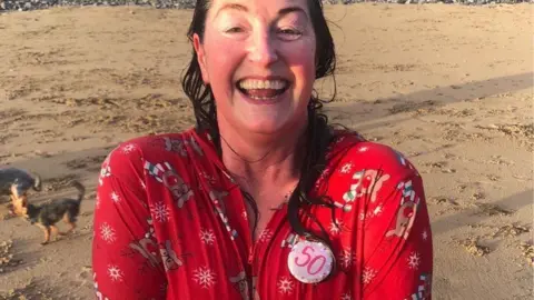 Porthcawl Christmas Swim Rhian Thomas celebrated turning 50 with a chilly dip off the beach in Porthcawl