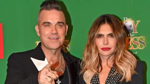 PA Media Robbie Williams and Ayda Field