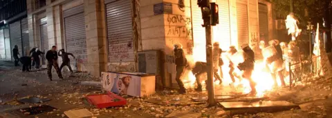 Getty Images Demonstrators throw fire bombs to riot police during violent protests in central Athens February 12, 2012.