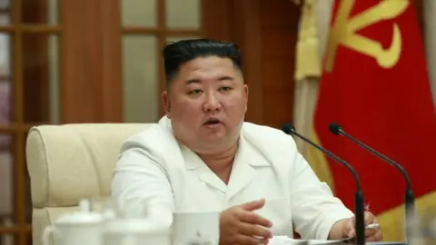 Reuters Kim Jong-un chairs a meeting on 25 Aug