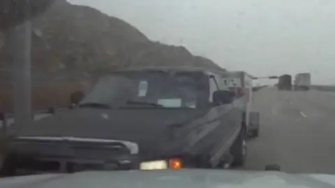 Pickup truck driving wrong way down highway