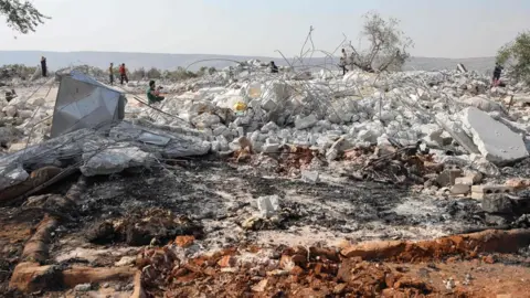 AFP Rubble of building destroyed during US raid near the Syrian village of Barisha (27 October 2019)