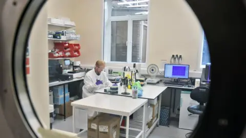 BBC Lab technician prepares samples at one of the new labs at the Health Security Agency, Porton Down, Salisbury