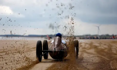Lee Smith / Reuters Motor racing on a beach