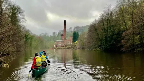 Peter Astle Peak paddle kayakers cleaning up the river banks