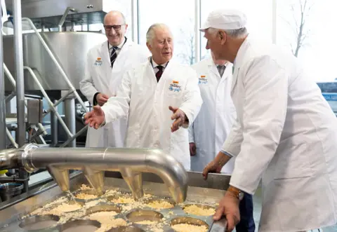 Reuters Brandenburg, Germany. King Charles III has a go at cheese making during a visit to an organic farm in Brandenburg, Germany,