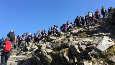 Peri Vaughan Jones A queue of people on Mount Snowdon