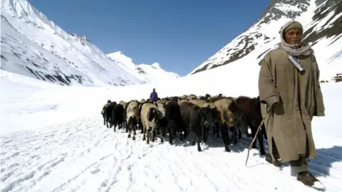 AFP Indian Kashmiri herdsmen are seen at Zojila, in Kargil district north-east of Srinagar