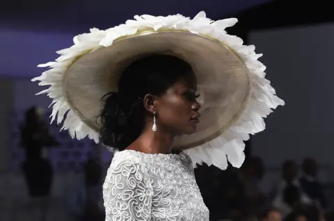 AFP A model presents a creation by designer Yemi Shoyemi during the Lagos Bridal Fashion Week in Lagos on May 4, 2018