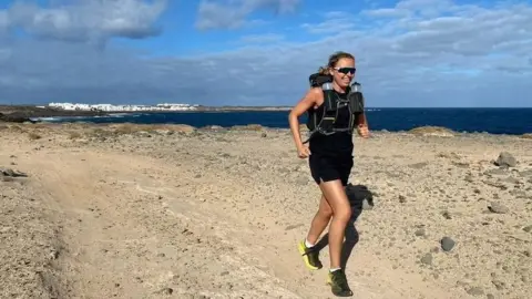 Beth Rainbow Ms Rainbow running on a cliff