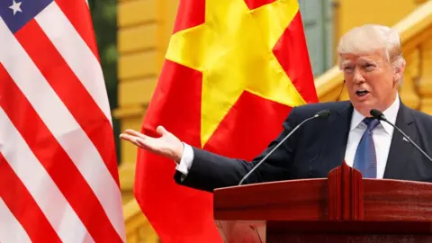 Reuters Trump addresses a conference at the Presidential Palace in Hanoi, Vietnam