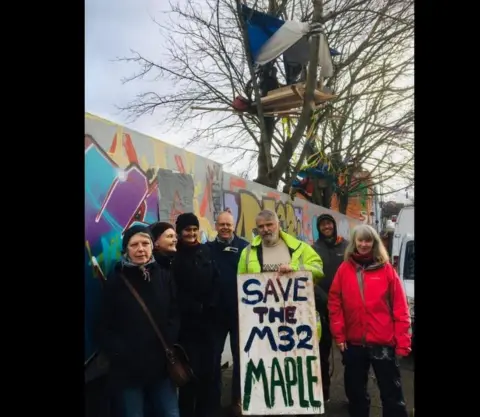 Save The M32 Maples Campaigners fighting the proposed felling of the three remaining maple trees