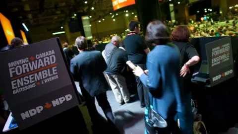 AFP Delegates queue up to vote during the 3rd ballot at the NDP leadership convention in Toronto, Ontario, March 24, 2012.