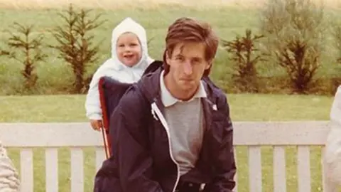 BBC Graeme carries his son Dan